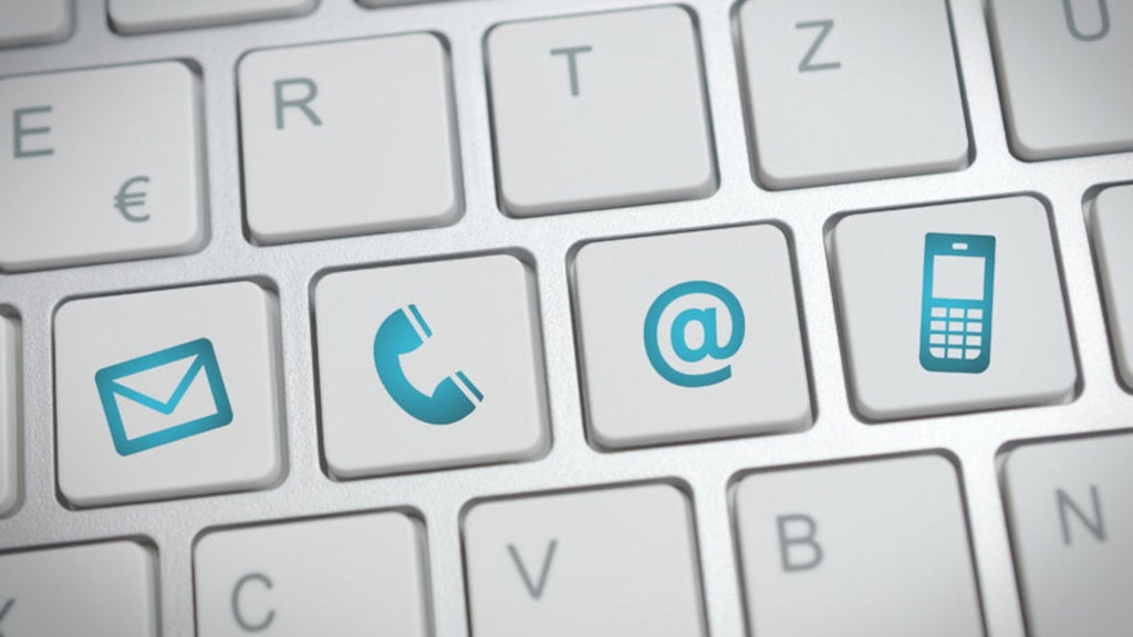 On voit une partie d'un clavier d'ordinateur blanc. En haut, les touches E, R, T, Z sont visibles. Au centre, la touche D est remplacée par une icône représentant une enveloppe. Au lieu de la touche F, on voit l'icône d'un combiné téléphonique. Au lieu de la touche G, l'image montre un signe @ et sur la touche H, un téléphone portable à touches.