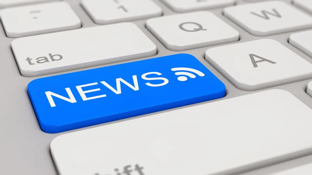 A computer keyboard with a blue key labeled "NEWS" and a symbol indicating a news feed or RSS. The key replaces a standard key.